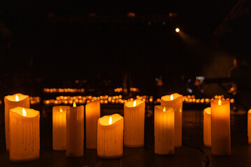 concert stage with lots of candles