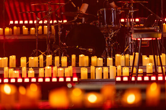 drum kit on concert stage with candles