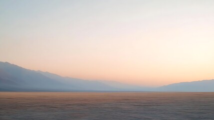 Naklejka premium Serene Sunset Over Vast Desert Mountain Landscape