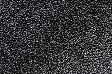 Black grainy plastic surface background