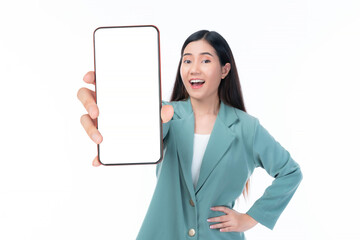 Beautiful Asian woman in a stylish green blazer holding a smartphone with a blank screen, smiling...