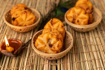 Traditional Thekua, a sweet crispy snack from Bihar made with jaggery and wheat flour, often prepared during festivals and special occasions.