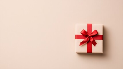 Gift box with red ribbon on a minimalist background