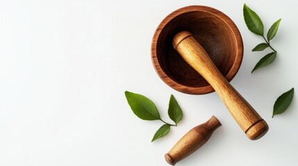 Wooden Mortar and Pestle with Fresh Leaves on a White Background
