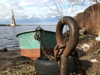 Wooden boat tied to the river