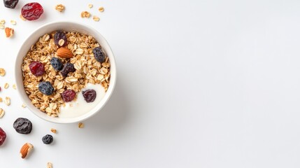 Healthy granola bowl with yogurt and mixed berries on white background