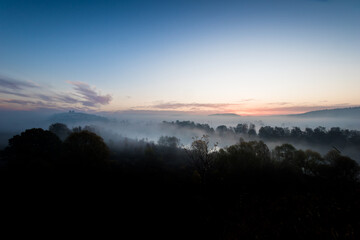 Fototapeta premium Benedictine abbey in Tyniec, foggy autumn sunrise. A monastery is located close to Kraków, Poland.