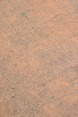 Abstract Texture in Rustic Orange Hues: This textured background features a rustic orange hue with intricate patterns and subtle variations.  Perfect for creating a warm, earthy.
