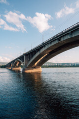 Naklejka premium Communal bridge over the Yenisei River at beauty sunny summer day in Krasnoyarsk city.
