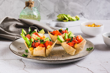 Mini poke bowls in pita bread on a plate on the table
