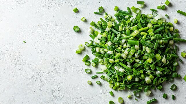 Chopped green onions on a textured surface highlighting fresh ingredients for cooking preparations
