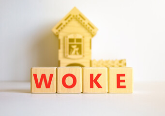 Woke question symbol. Concept word Woke question on beautiful wooden blocks. Beautiful white table white background. Wooden house. Business, lifestyle, support and woke question concept. Copy space.