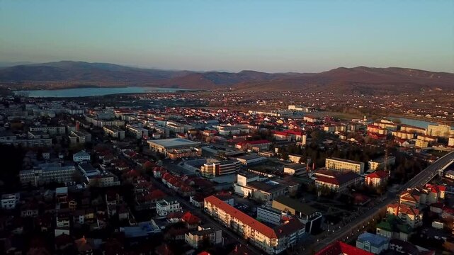 Aerial view of Ramnicu Valcea, Romania, highlighting the architecture, hills, and nature