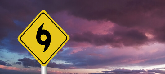 danger,caution,Hurricane Idalia warning sign against a powerful stormy background with copy space. Dirty and angled sign with cyclonic winds add to the drama.hurricane season sign on cloudy background