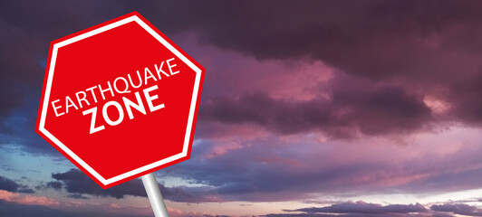 Caution Earthquake Zone Sign on Cracked Rock Background