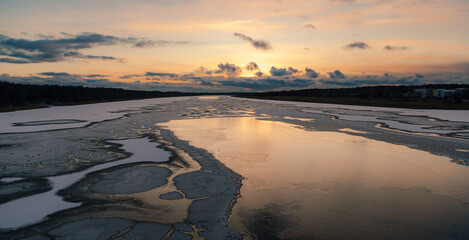 Scenic landscape sunset on a freezing river, Jurmala, Lielupe, Latvia. 