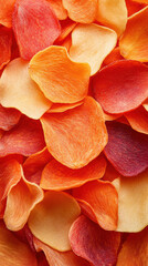 Fototapeta premium Vibrant dried vegetable chips in assorted red and orange colors for healthy snacking concept