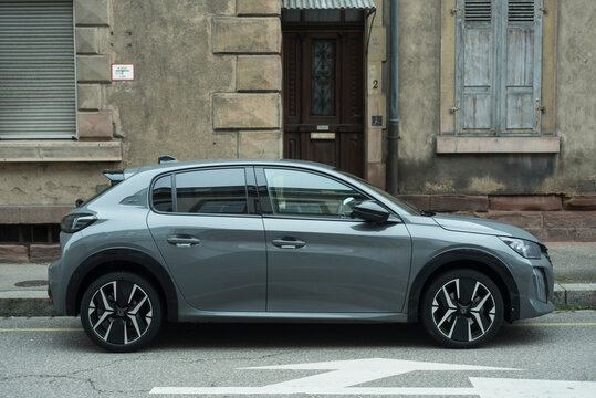 Mulhouse - France - 16 february 2025 - Profile view of grey peugeot 208 parked in the street