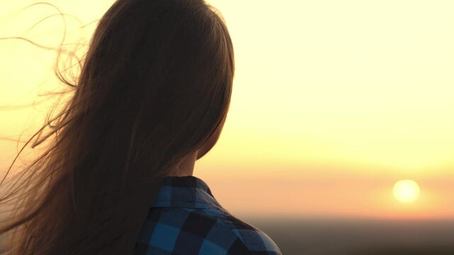 girl with long hair wind. smile child girl sunset. person breathes fresh air. eco. girl dream. teenager pray dawn. beautiful face long-haired girl wind close-up. clean air concept. breath nature park.
