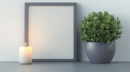 Empty modern frame with a plant pot and a soft candle beside it isolated
