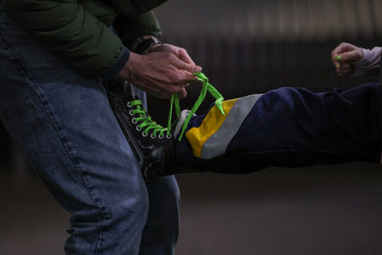 Man tying Skates