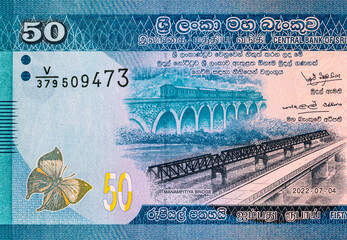 Banknote 50 rupees Sri Lanka with the image of Manampitiya Bridge, fragment for design. Money of...