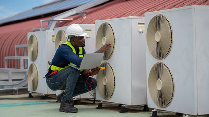 Engineers inspecting the air conditioning system in a large building or industrial facility.