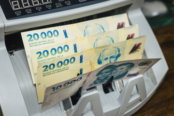 Argentina new banknotes. Money counting machine. banknotes of 20 and 10 thousand Argentine pesos....