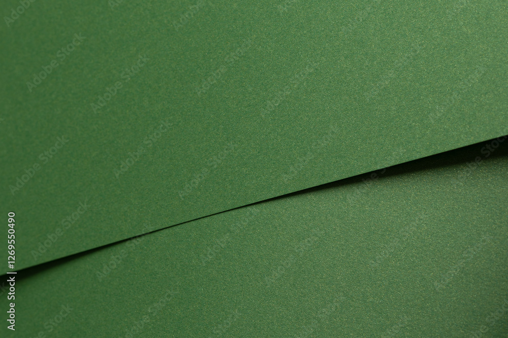 Fototapete Deep forest green paper background with a smooth matte texture and subtle geometric patterns. Rich basil and olive tones