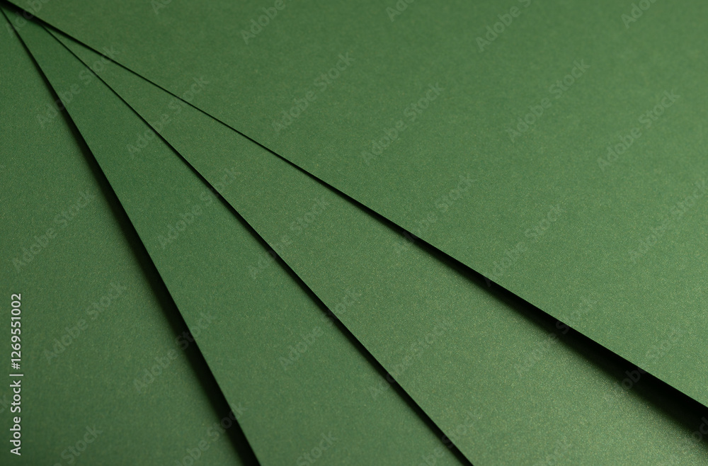 Fototapete deep forest green paper background with a smooth matte texture and subtle geometric patterns. rich b