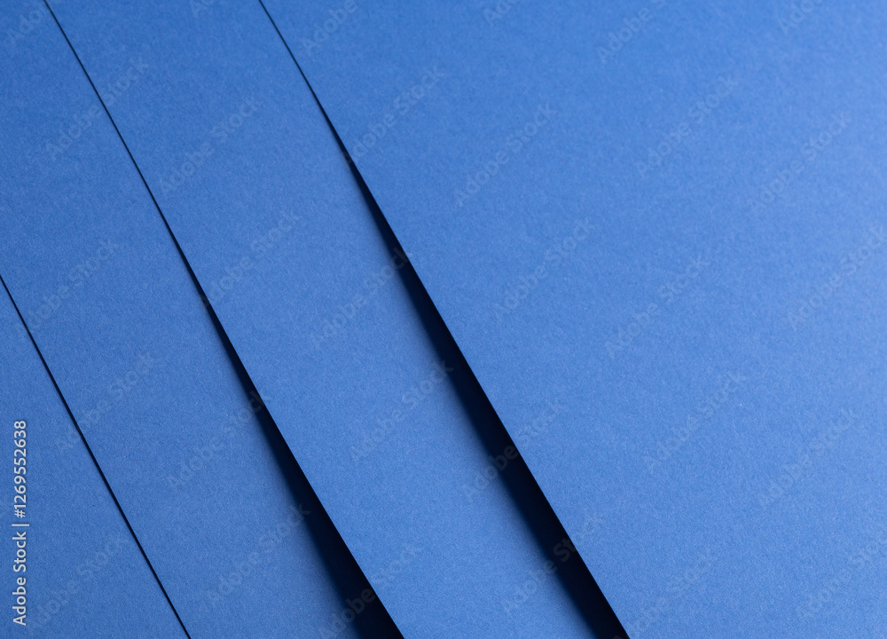 Poster Deep sapphire blue paper background with a smooth texture and overlapping curved folds. Vibrant cobalt and ultramarine tones create a minimal, rhythmic, and flowing abstract composition with geometric