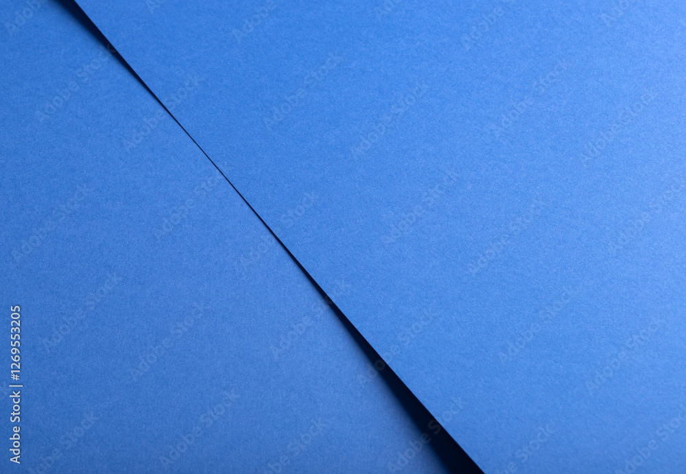 Poster Deep sapphire blue paper background with a smooth texture and overlapping curved folds. Vibrant cobalt and ultramarine tones create a minimal, flowing, and abstract composition with geometric lines