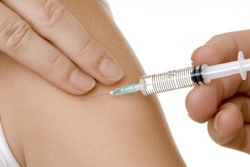 Injection scene: A syringe administering medication into an arm, focusing on healthcare practice