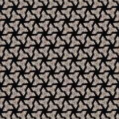 a geometric pattern featuring interlocking triangular shapes. The design is composed of textured elements in shades of beige and black, creating a contrast that highlights the pattern's intricacy.