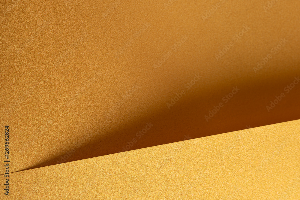 Fototapete Golden yellow paper background with deep ochre and saffron tones. Layered, folded textures and subtle geometric lines create a soft, elegant, and harmonious abstract design.