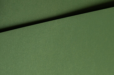 Moss green paper background with a smooth matte texture and subtle geometric lines. Deep forest and olive tones create an elegant, refined, and sophisticated abstract design with organic depth.