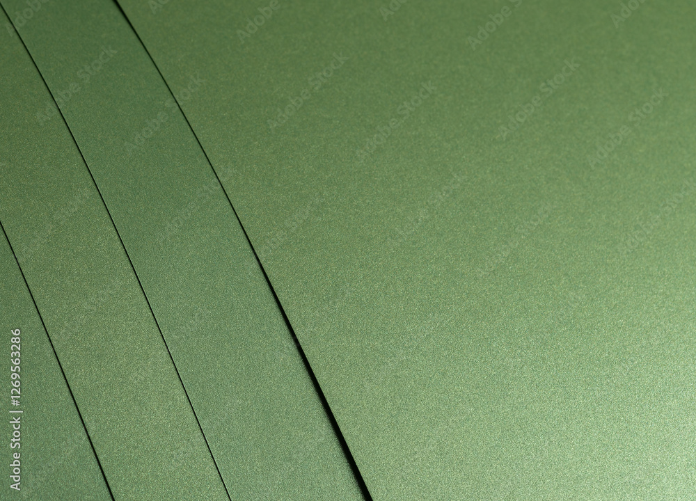 Aufkleber Moss green paper background with a smooth matte texture and subtle geometric patterns. Deep forest and olive tones