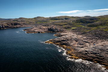 top view of the coast of the Barents Sea near the village of Teriberka on a clear summer day