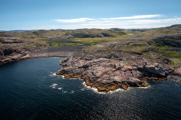 top view of the coast of the Barents Sea near the village of Teriberka on a clear summer day