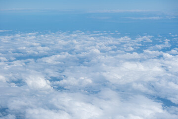 Aerial view of sky and cloud seen from window of airplane
