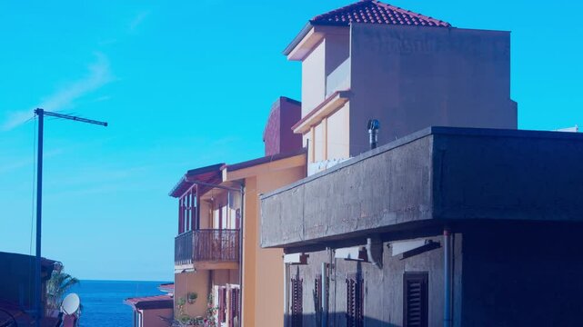 narrow street leading to the sea, italian town scilla