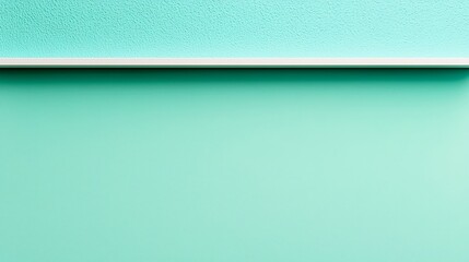 A minimalist image featuring a textured turquoise surface with a subtle white border, conveying tranquility and simplicity.