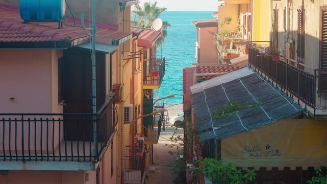city ​​beach of italian city scilla, city fountain on the beach by the blue sea, resort

