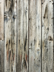texture of aged boards covered with cracks, knots and traces of time.