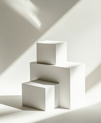 Minimalist white display podiums in sunlit studio