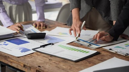 Small group of businessmen starting company, planning creative meeting using digital tablet showing financial data and graphs and laptop, financial analysis. - Powered by Adobe