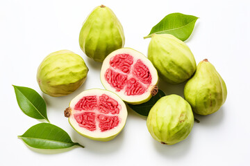 Pile of green guavas with one of them cut open.