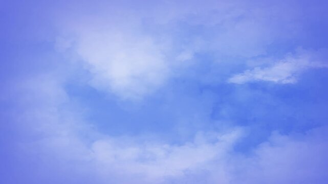 Free Falling Through the Clouds 4k Loop features a view of a blue sky falling down through moving clouds in a loop. 