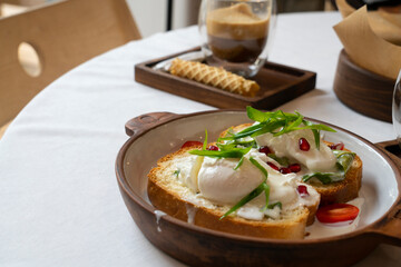 Brioche with poached egg for breakfast
