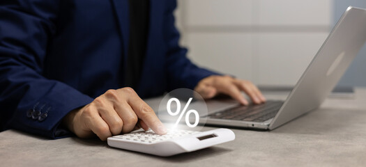 close up manager businessman hand press on calculator to calculate about commission rate form...